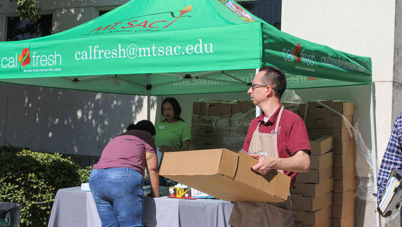 CalFresh was also on-site to assist students in applying for grocery money. Photo by Michael Tseng.