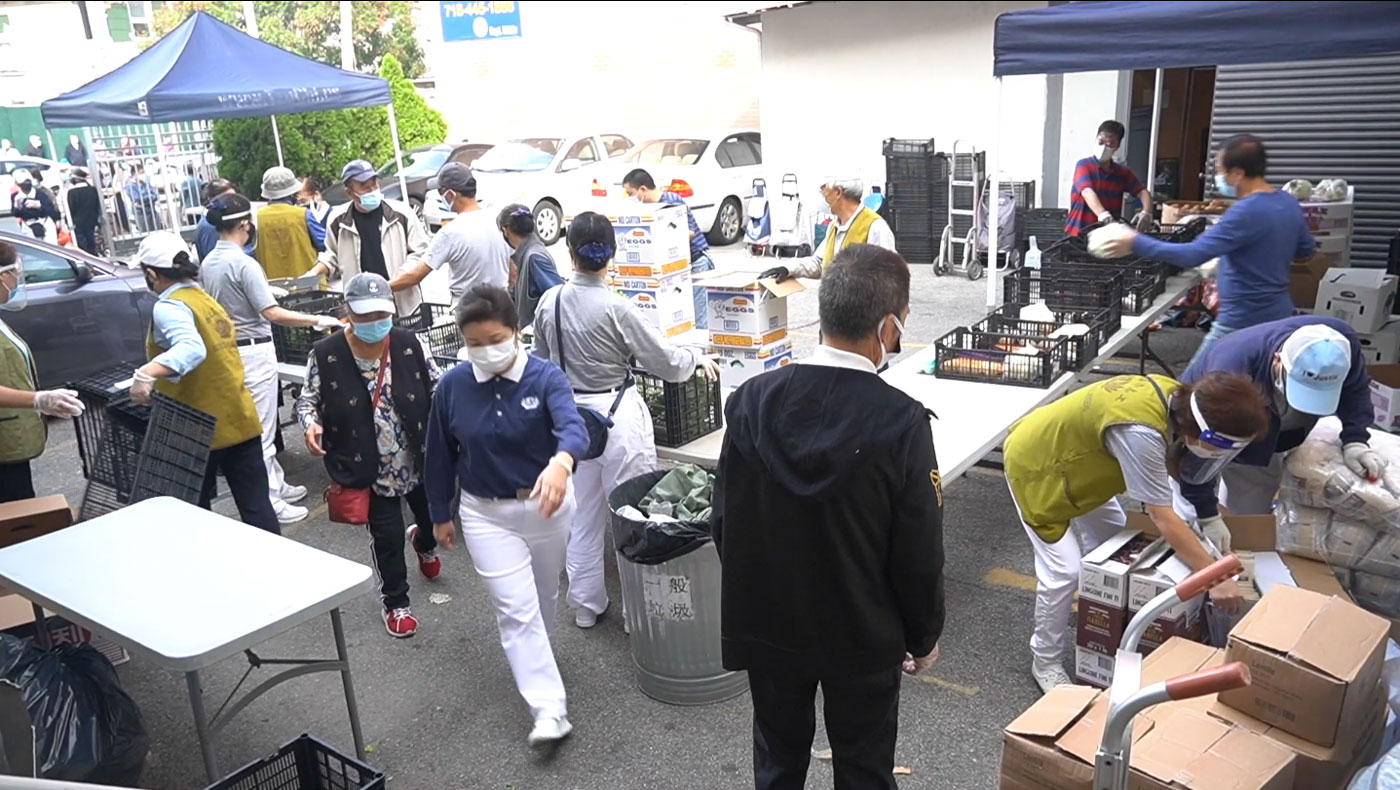 Tzu Chi volunteers mobilize for a food distribution event in Flushing, New York, every Friday, rain or shine. Video Screenshot/Tzu Chi USA Video Team