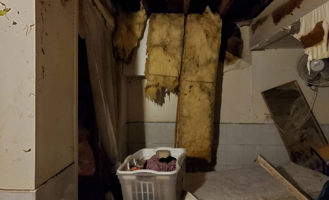 As the basement floods completely,  the water destroys the insulation foam in the ceiling, leaving the wooden structure exposed. Photo/Shan Shan Chiang
