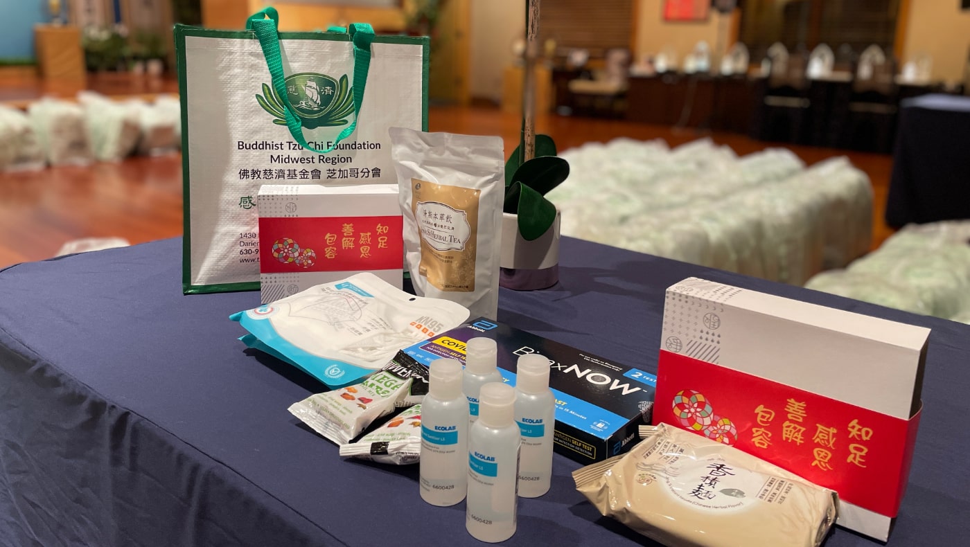 Volunteers prepare supplies to be distributed to survivors. Photo/Yue Ma