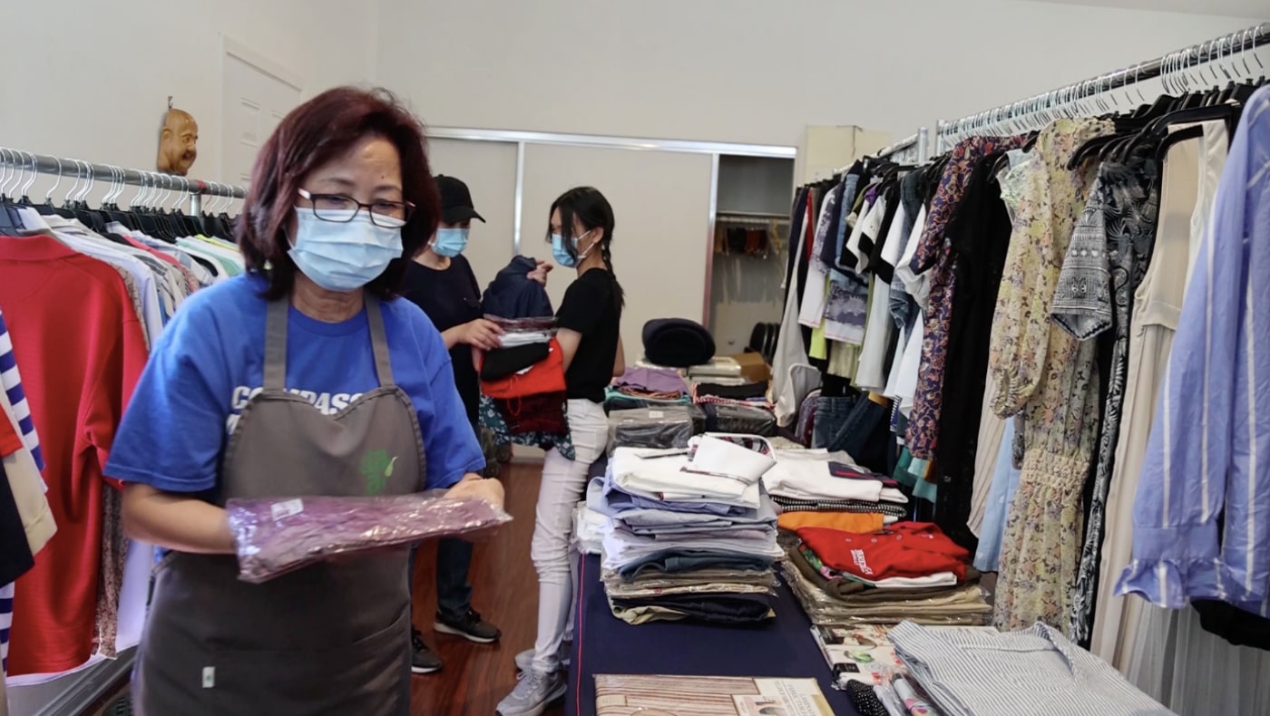 TzuchiUSA-HQ Tzu Shao packs clothes for Ukrainians-2