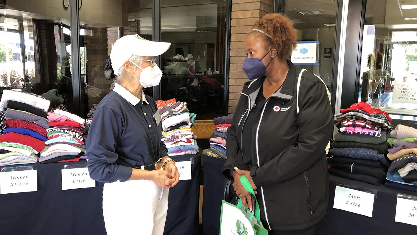 Tzu Chi volunteers distribute clothing for survivors of the River Place Apartment Community fire in Brown Deer
