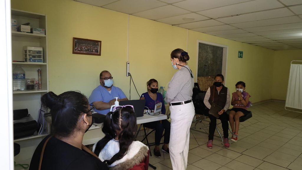 Patients wait for a consultation and dental treatment at the free clinic.