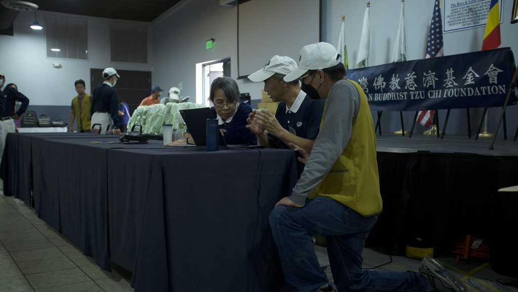 Tzu Chi volunteers finalize preparations at the Boys & Girls Club of Lee County distribution site