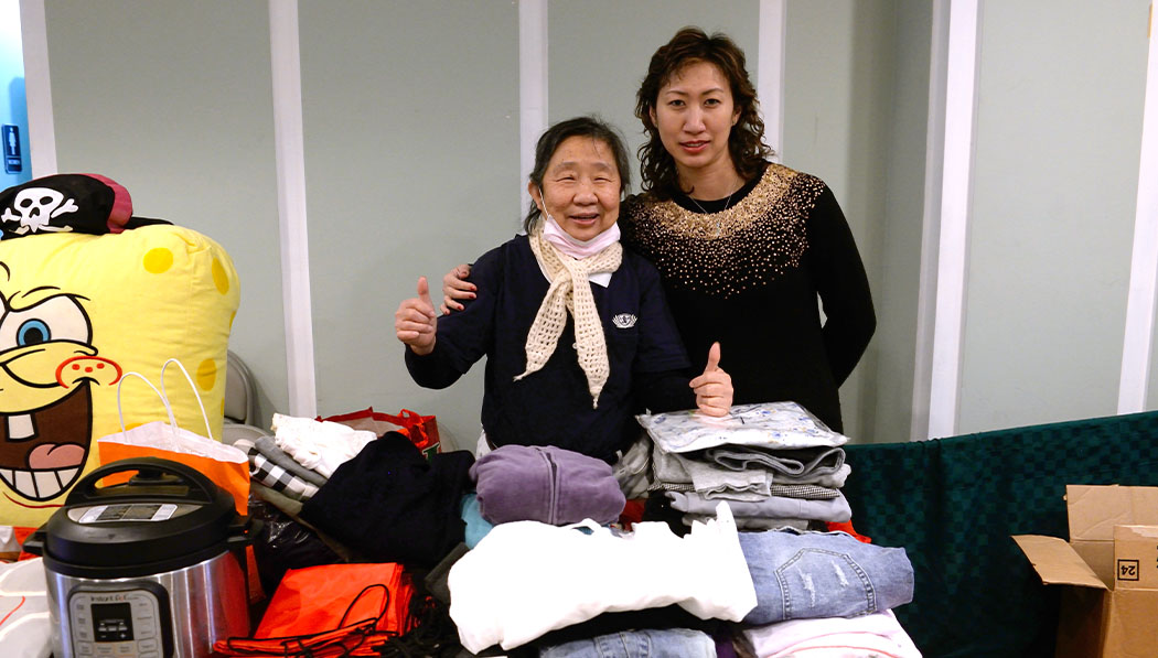 Tzu Chi USA volunteers in second hand clothes booth