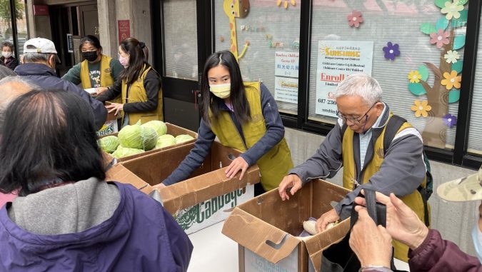 Tzu Chi Boston volunteers distributing food at Taitung Village