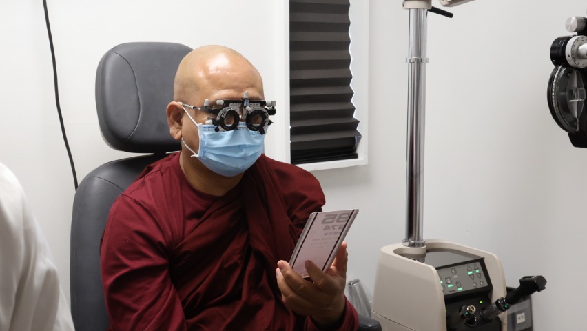 Tzu Chi Medical volunteer offers eye examination to Myanmar Monk