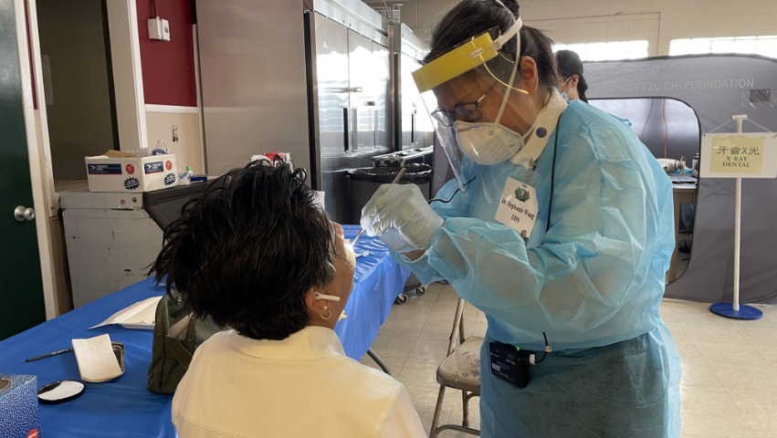 Tzu Chi internal medicine volunteer giving medical assessment