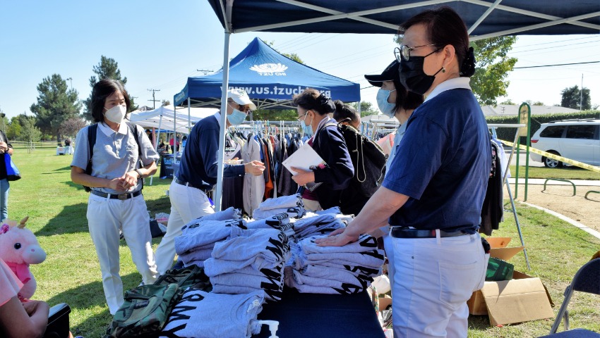 Tzu Chi T-shirts are neatly folded by volunteers