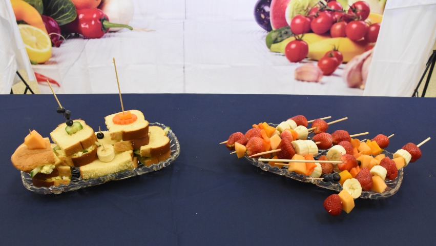 Fruit skewers and cakes made by Tzu Chi DC Academy students
