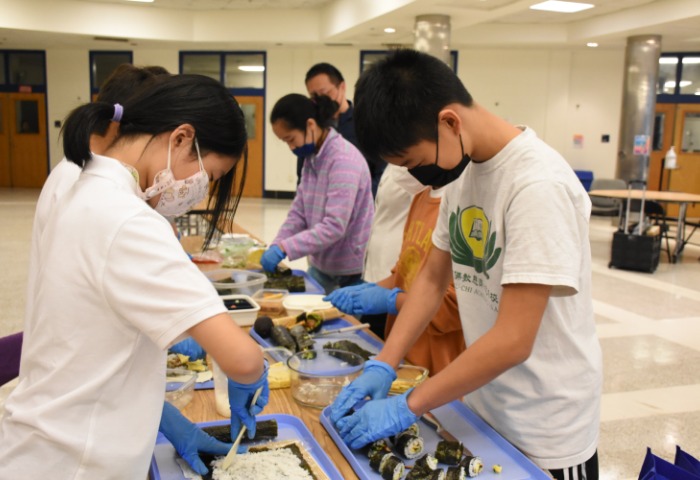 Tzu Chi DC Academy students making sushi whole heartily