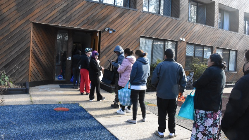 Recipients lining up for the Tzu Chi DC Reston Indoor Food Distribution