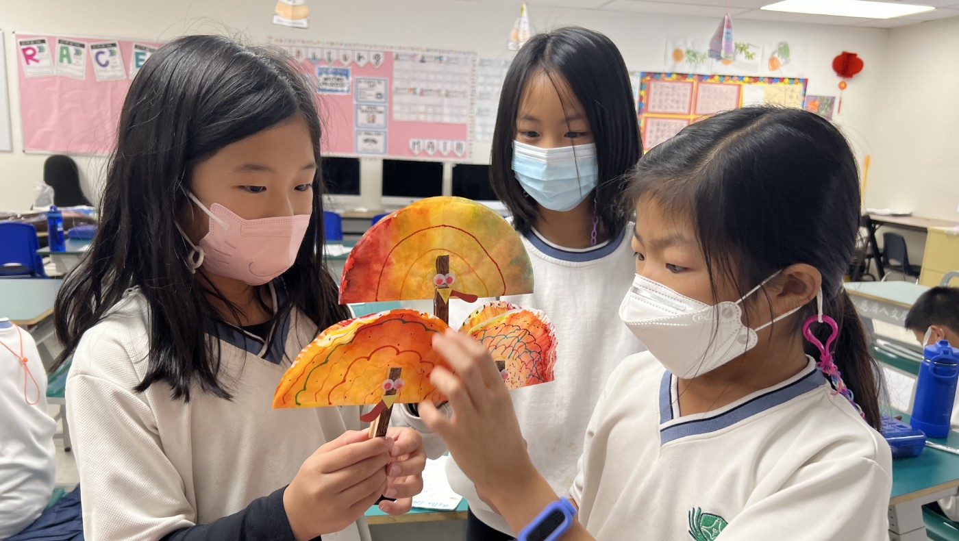 Tzu Chi Walnut Elementary School students creating paper turkey