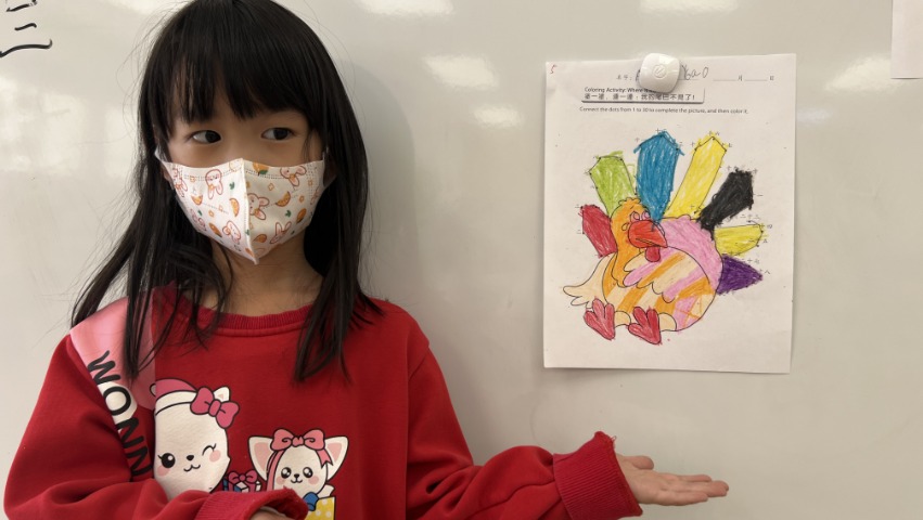 Tzu Chi Walnut Elementary School student sharing her turkey painting
