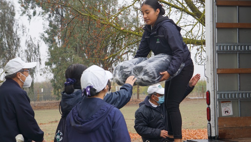 Tzu Chi volunteers delivering winter supplies