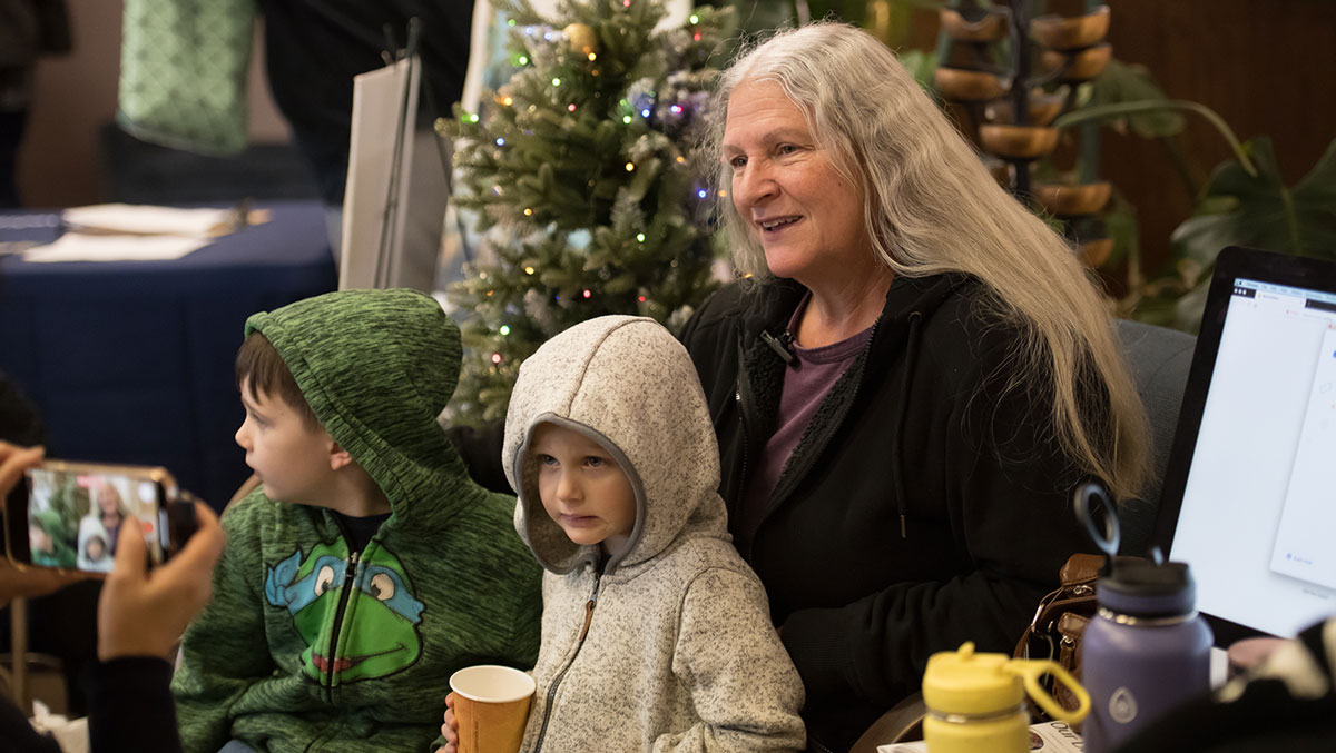 Patti Tucker attends the holiday celebration with her grandchildren. Photo/Min Yung Cheung