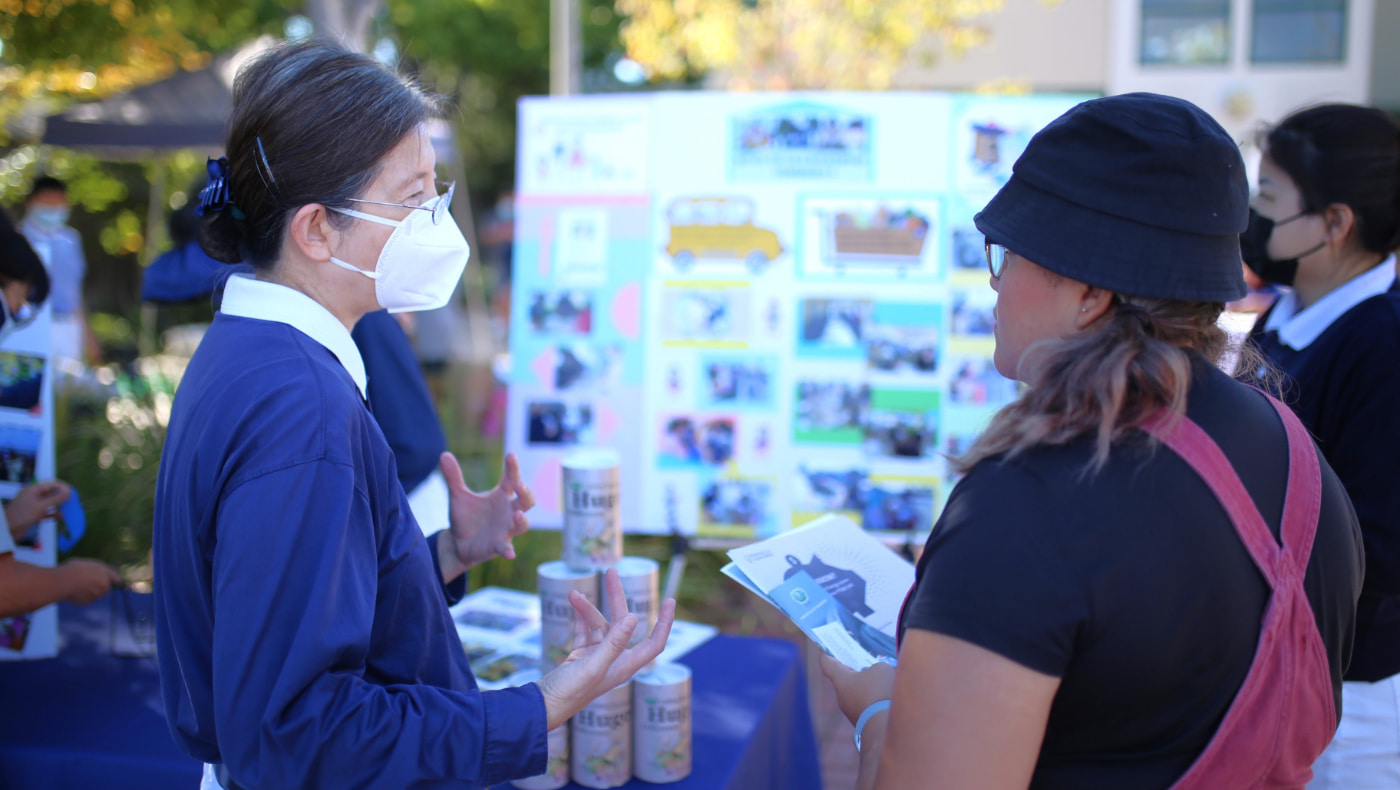 Tzu Chi volunteers told Claudia that the next Tzu Chi free clinic in East Palo Alto will invite care recipient families from Family Connections. Photo/Yiwen Qiu