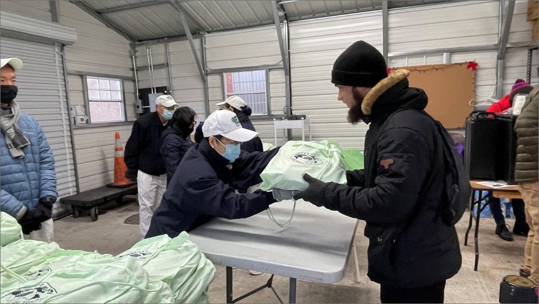 Tzu Chi Volunteers distributing items to the people in need from Cherry Hill