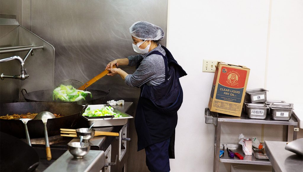 Tzu Chi USA Southern Region volunteer preparing food