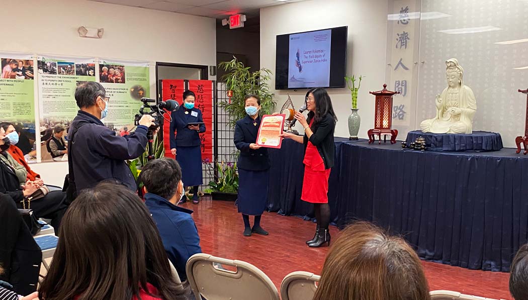 Tzu Chi USA Cerritos volunteer receiving reward from Los Angeles County