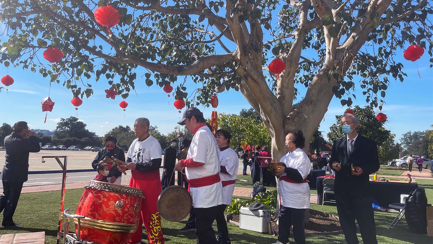 Tzu Chi USA volunteers playing dragon dance for Lunar New Year blessing