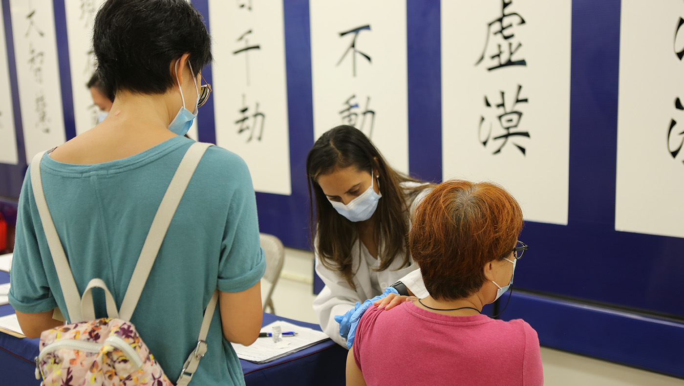 Medical volunteers provide vaccinations