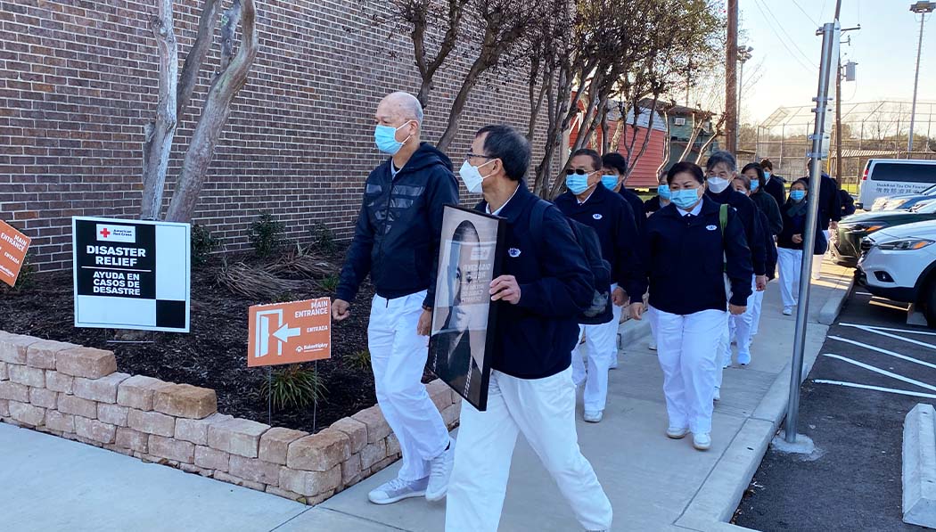 Tzu Chi USA volunteers walking to the BakerRipley Pasadena Campus for the relief