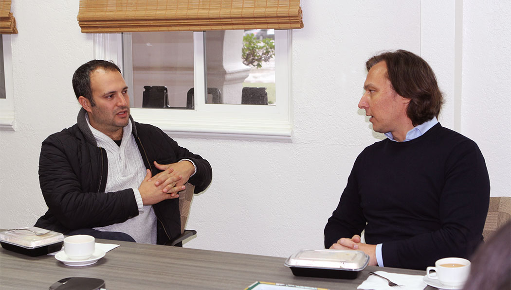 Yotam Polizer (left), global CEO of IsraAID and Alex Balint (left), representative of ADRA talking