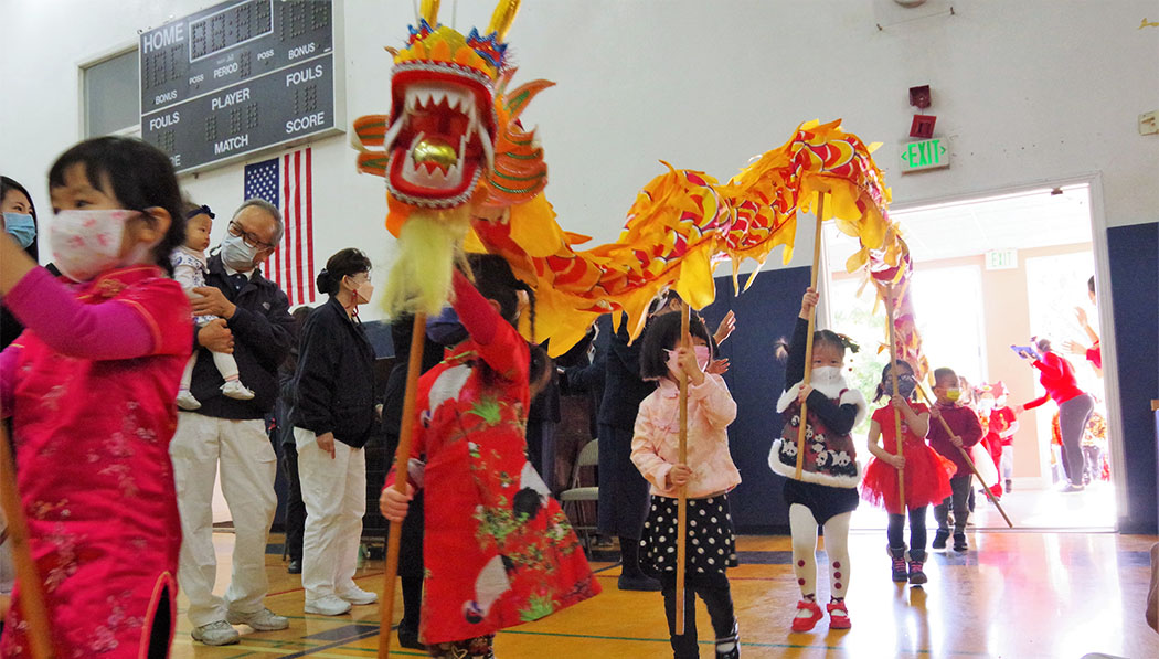 Tzu Chi Academy student performing dragon dance