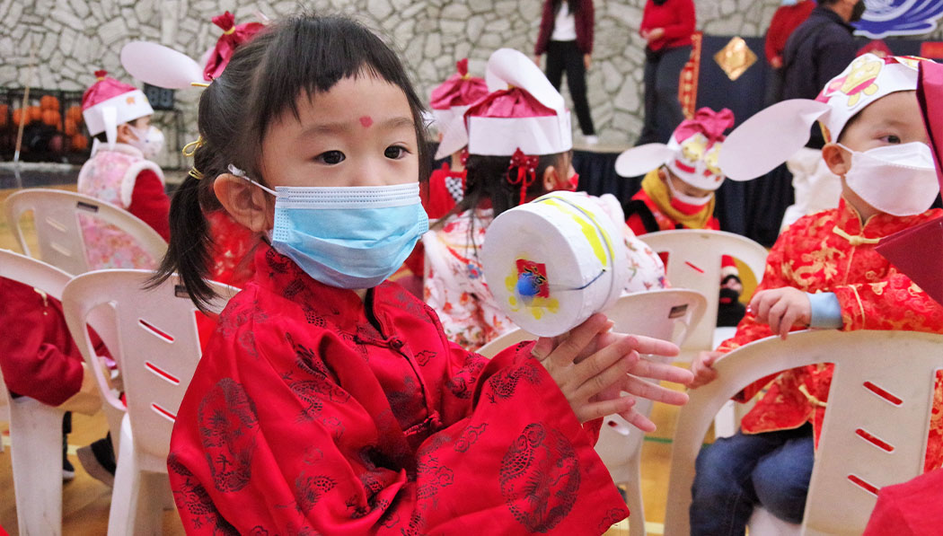 Children holding Tambourine with traditional Chinese