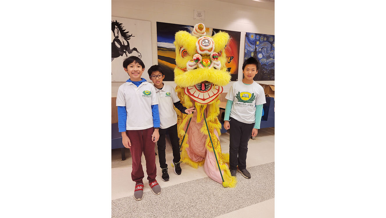 Tzu Chi academy students with lion dance performer