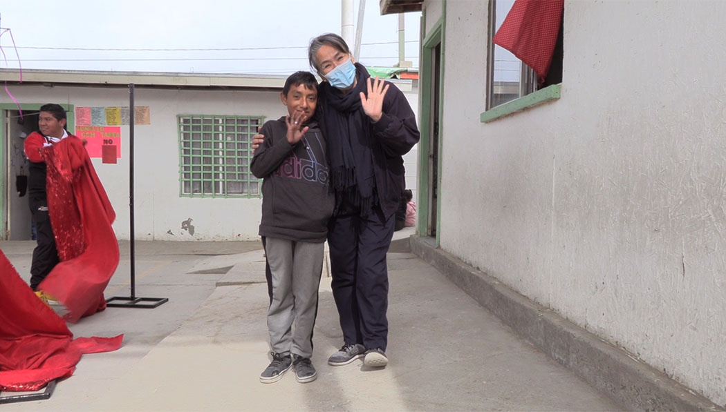 With all the prepared admission materials, Silas (left) is finally able to reenter school and receive an education. Photo source / Tzu Chi USA