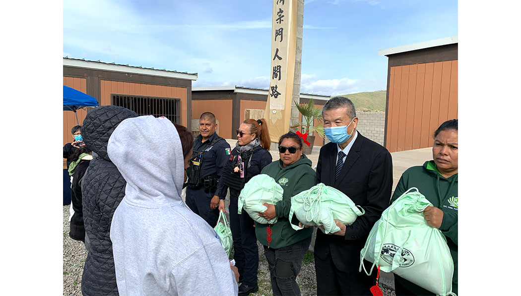 Tzu Chi volunteers distributing supplies to the care recipients