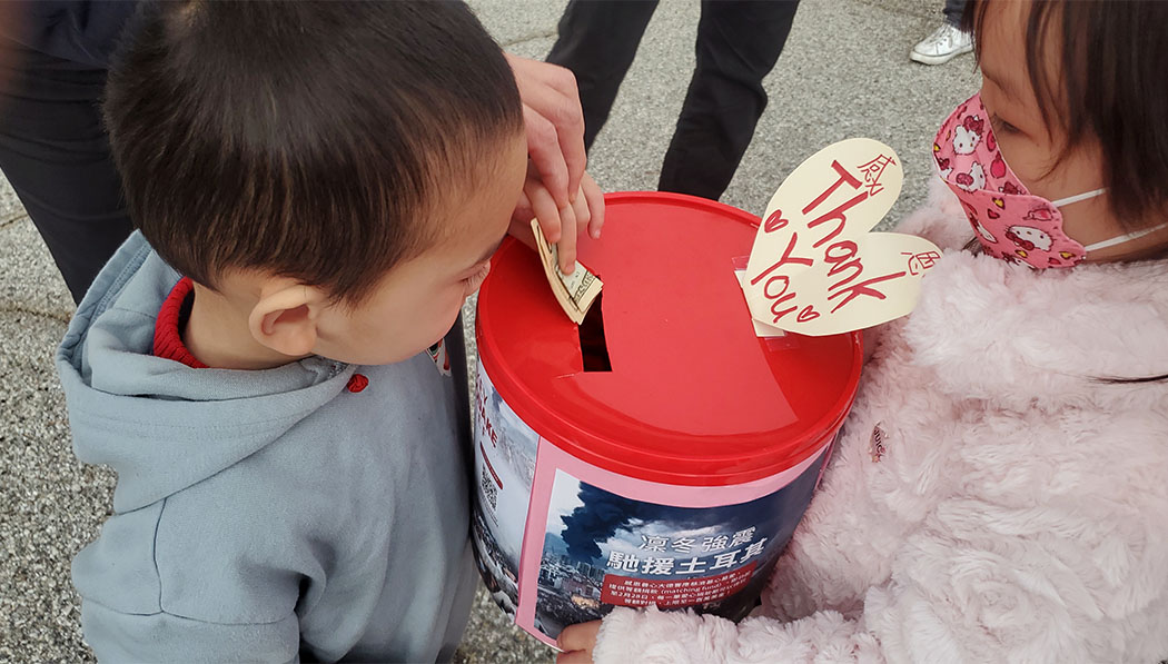 Tzu Chi Preschool students donating