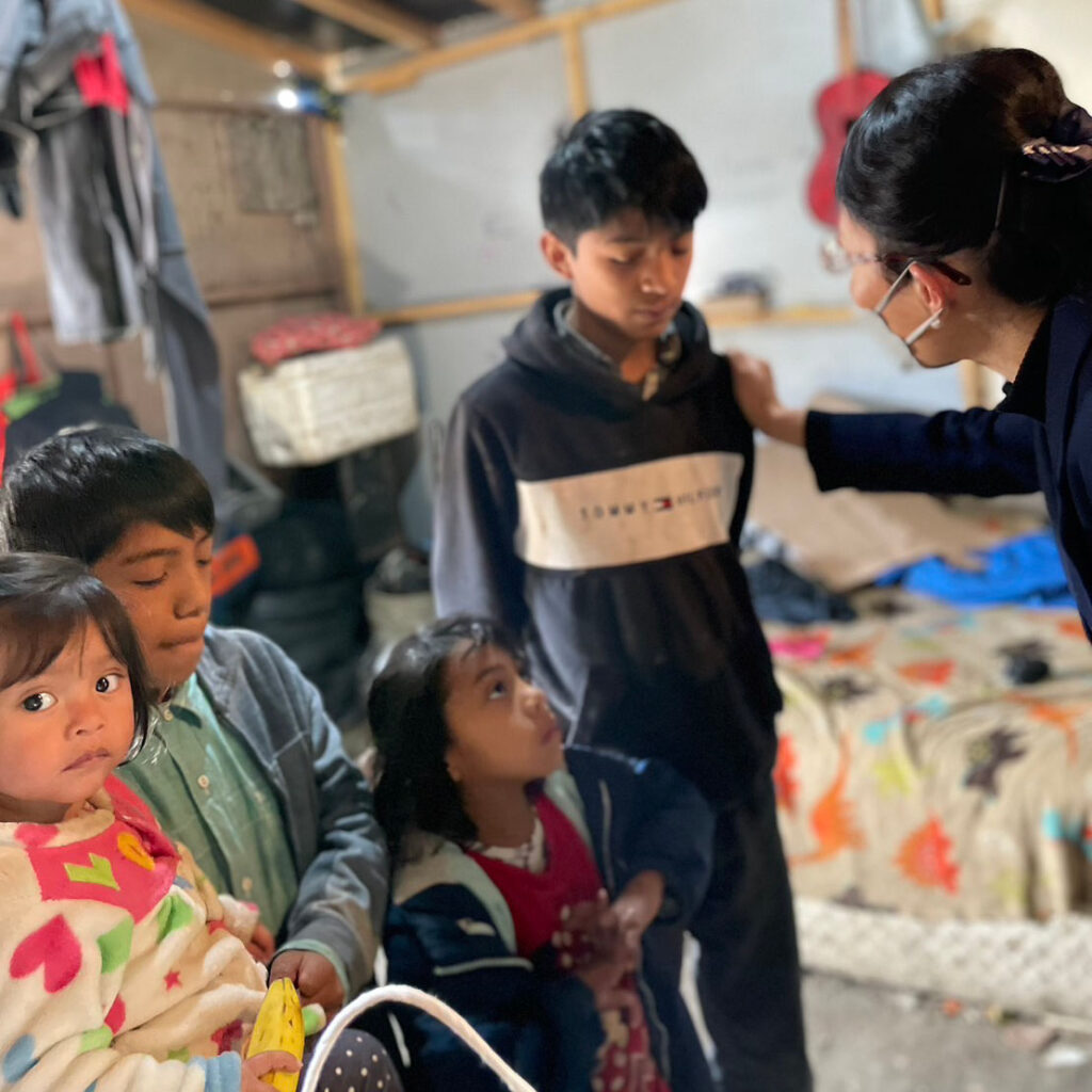 Tzu Chi volunteer interacting with children in Tijuana