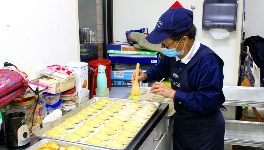 Tzu Chi volunteer making Taiwanese cookies