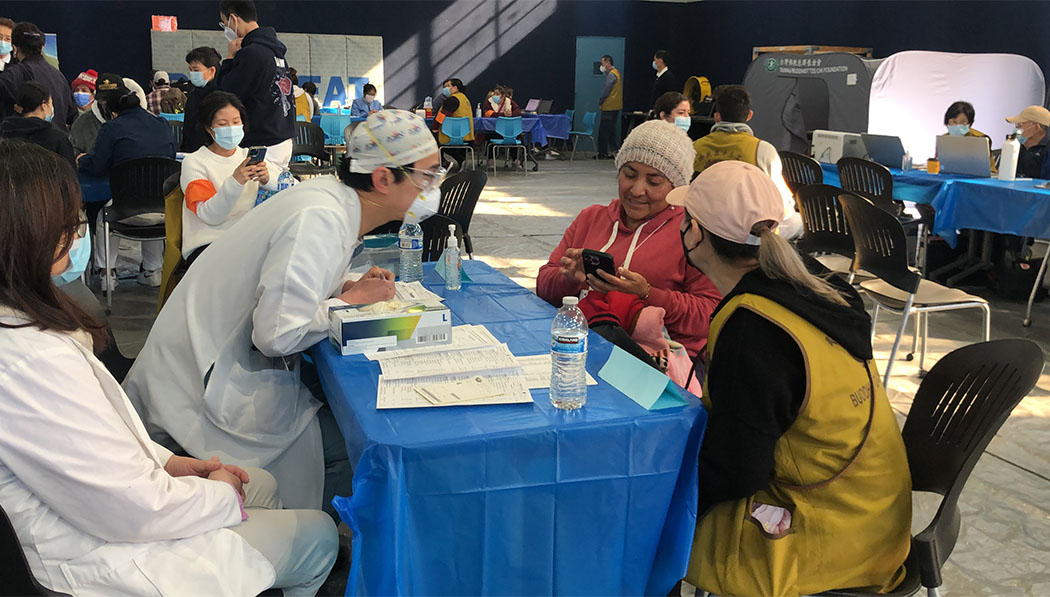Tzu Chi volunteer, doctor and medical outreach patient