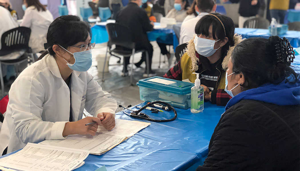 Tzu Chi volunteer doctor asking patient questions