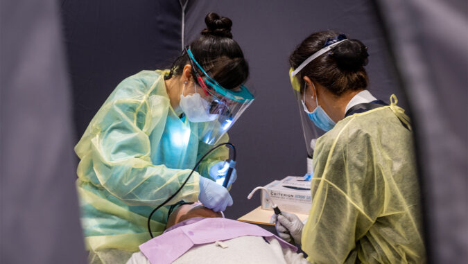 Tzu Chi volunteer dentist giving dental treatment to the patient