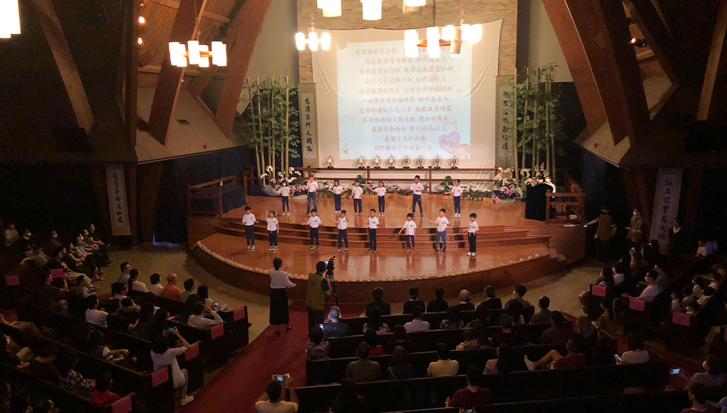 Tzu Chi Dallas Academy student performing on the stage