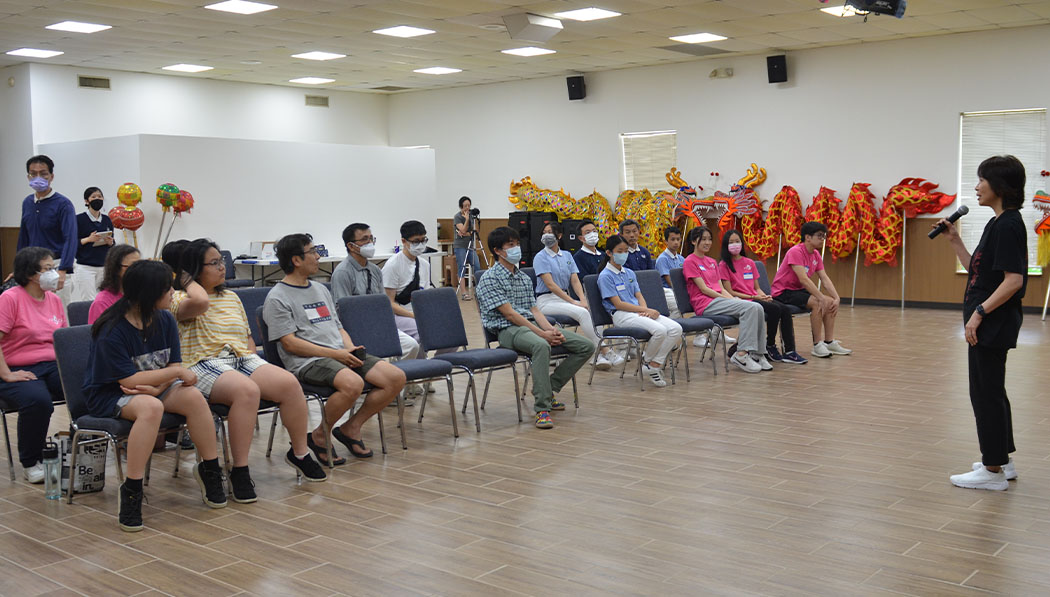 Students listening to the dragon dance class briefing