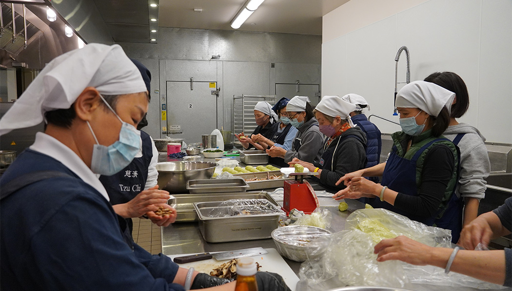 Tzu Chi volunteers preparing foods for the food sale fundraising