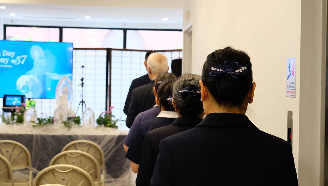 Group praying for the Buddha bathing ceremony in Tzu Chi Center