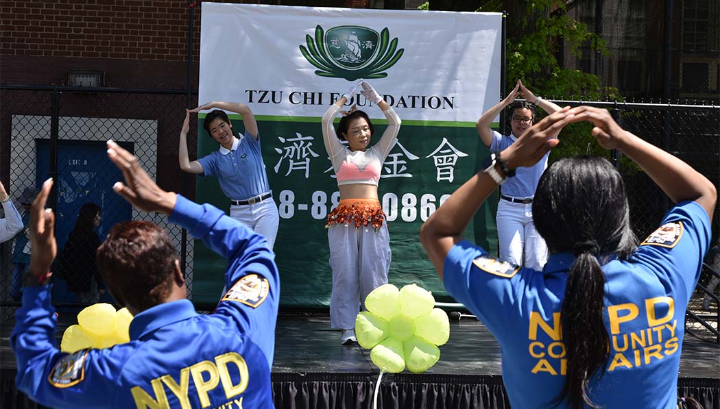 Tzu Chi volunteers performing on the stage