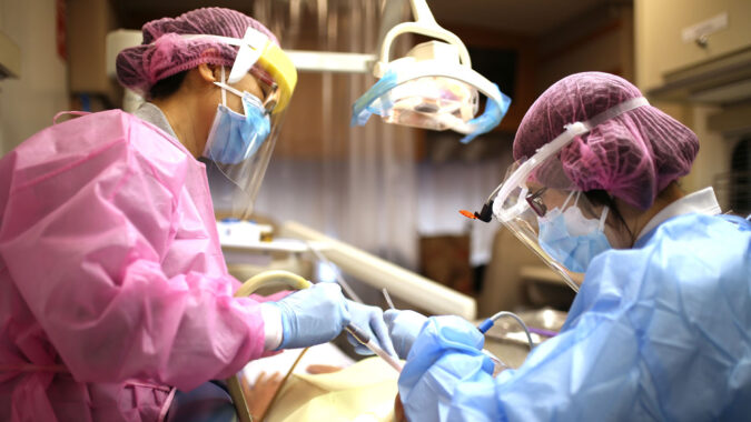 Dentists giving dental treatment