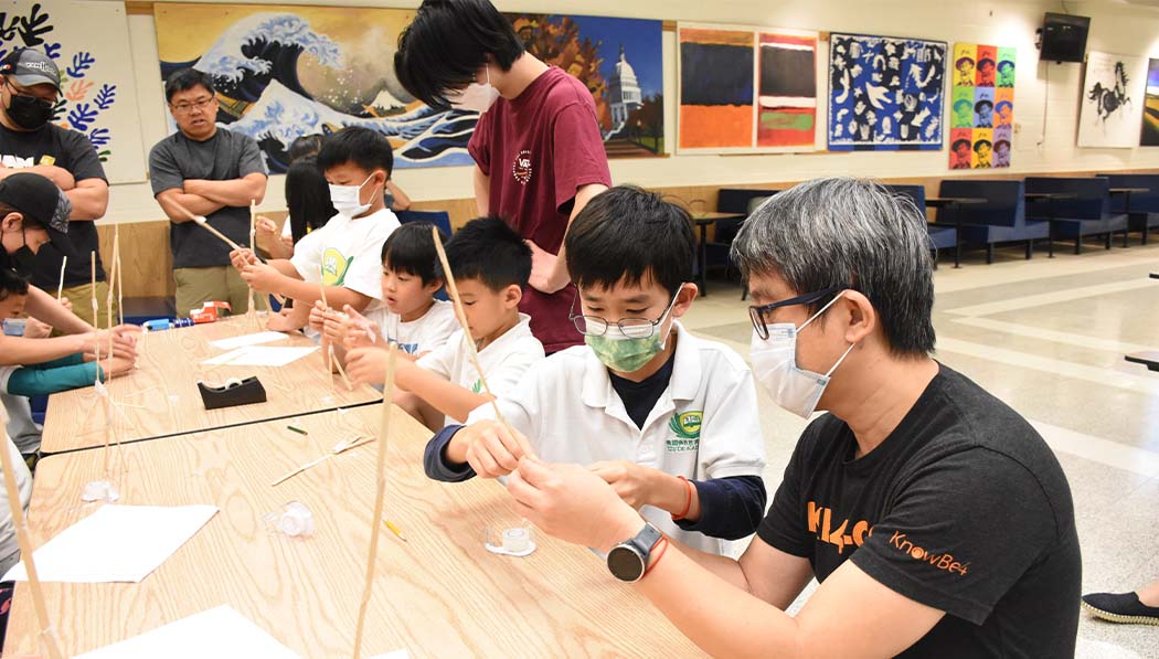 Tzu Chi DC Academy students building with their parents