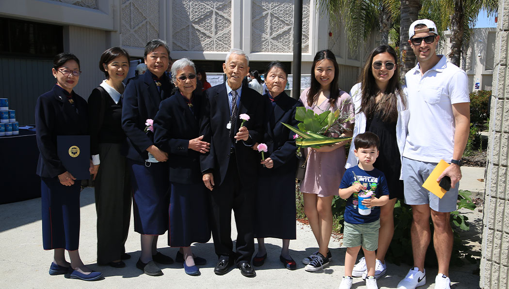 Tzu Chi volunteers and a family of visitor