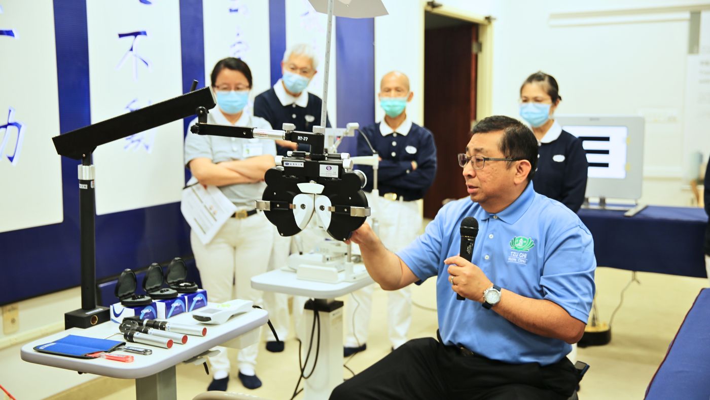 Volunteers demonstrate the use of ophthalmic instruments during the training workshop.