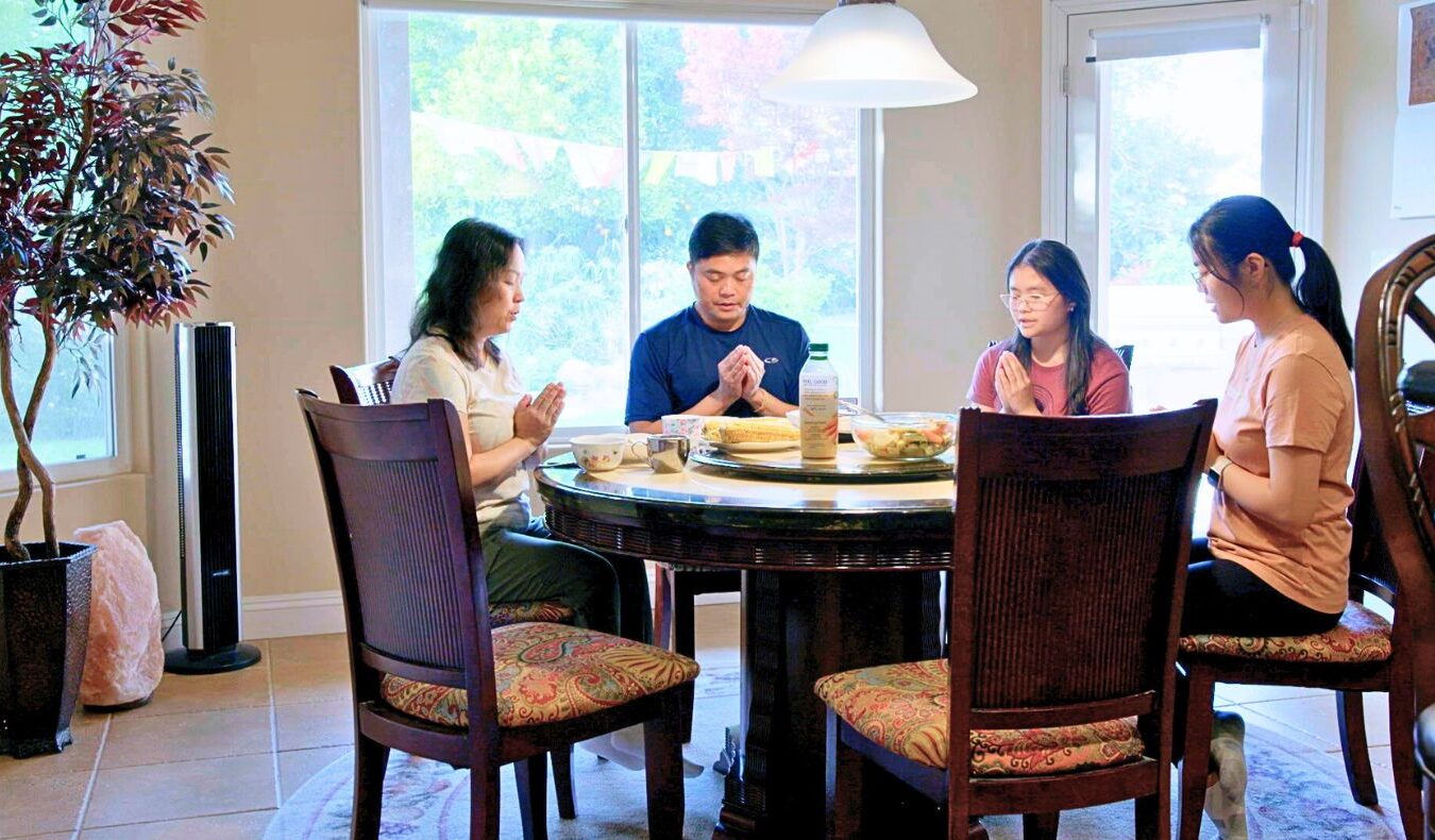 Dr. Phu Truong's family at home praying