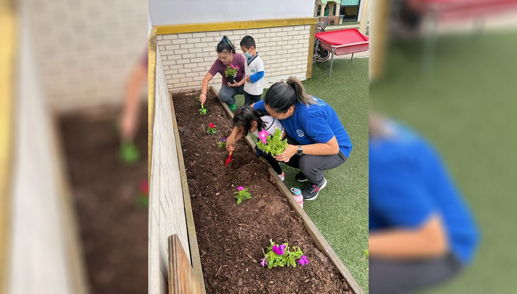 Houston Great Love Kindergarten parent and students planting together